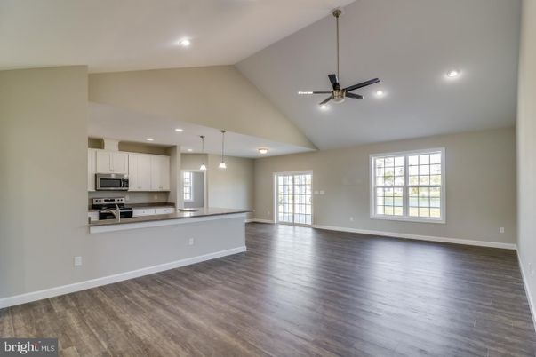 Empty room, Interior, Kitchen, Pendant Lights, Recessed Lighting, Stainless Steel Appliances, Wood Texture Flooring