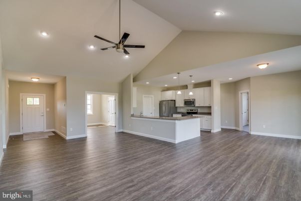 Empty room, Interior, Kitchen, Pendant Lights, Recessed Lighting, Stainless Steel Appliances, Wood Texture Flooring