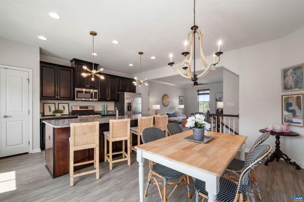 Chandelier, Dining room, Interior, Kitchen, Living room, Pendant Lights, Recessed Lighting, Stainless Steel Appliances, Wood Texture Flooring