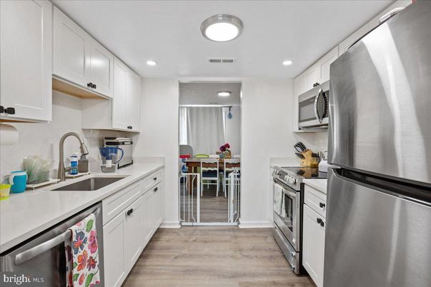 Dining room, Interior, Kitchen, Recessed Lighting, Stainless Steel Appliances, Wood Texture Flooring