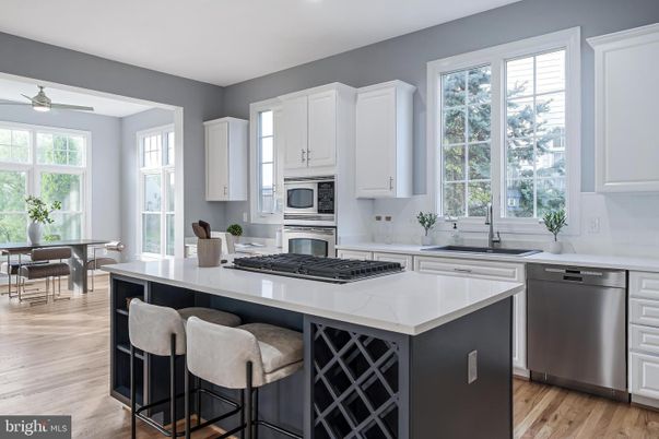 Dining room, Interior, Kitchen, Recessed Lighting, Stainless Steel Appliances, Wood Texture Flooring