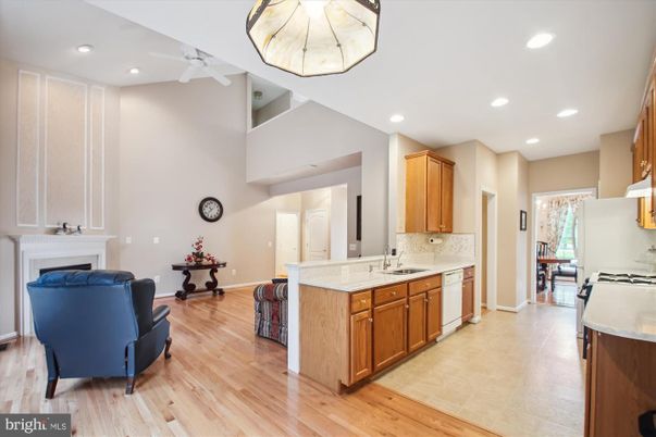 Fireplace, Interior, Kitchen, Recessed Lighting, Wood Texture Flooring