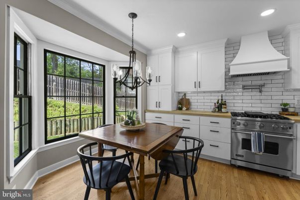 Chandelier, Dining room, Interior, Kitchen, Pendant Lights, Recessed Lighting, Stainless Steel Appliances, Wood Texture Flooring