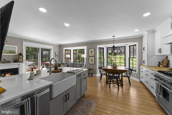 Chandelier, Dining room, Fireplace, Interior, Kitchen, Living room, Pendant Lights, Recessed Lighting, Stainless Steel Appliances, Wood Texture Flooring