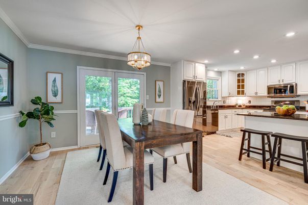 Chandelier, Dining room, Interior, Kitchen, Recessed Lighting, Stainless Steel Appliances, Wood Texture Flooring