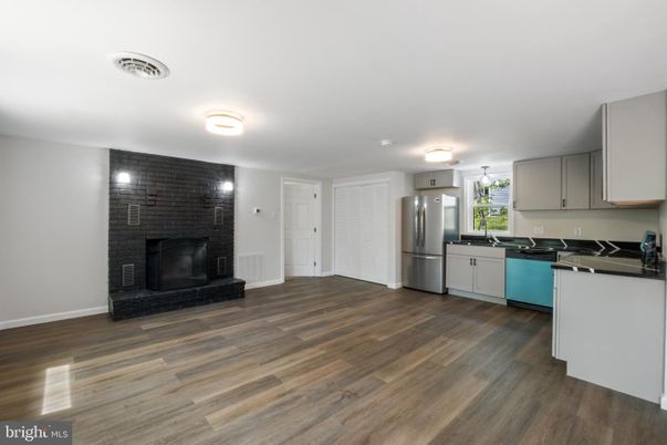 Fireplace, Interior, Kitchen, Stainless Steel Appliances, Stone Walls, Wood Texture Flooring