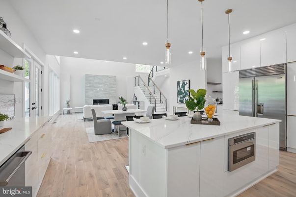 Dining room, Fireplace, Interior, Kitchen, Living room, Pendant Lights, Recessed Lighting, Stainless Steel Appliances, Wood Texture Flooring