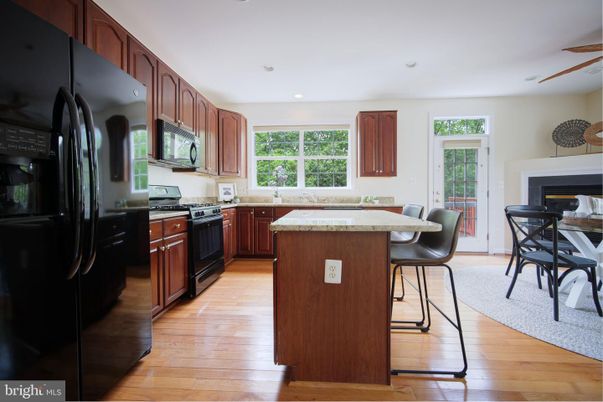 Dining room, Fireplace, Interior, Kitchen, Recessed Lighting, Wood Texture Flooring