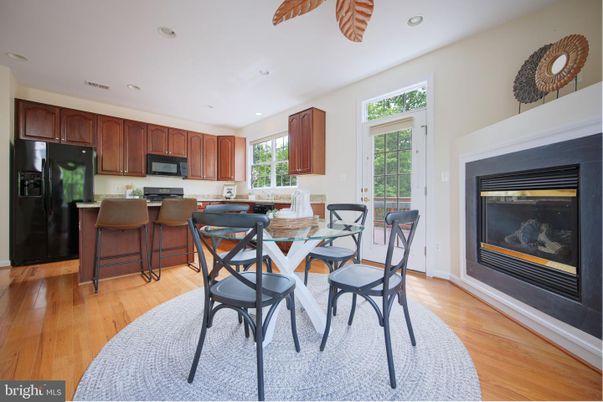 Dining room, Fireplace, Interior, Kitchen, Recessed Lighting, Wood Texture Flooring