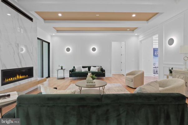 Fireplace, Interior, Living room, Marble Walls, Recessed Lighting, Wood Texture Flooring