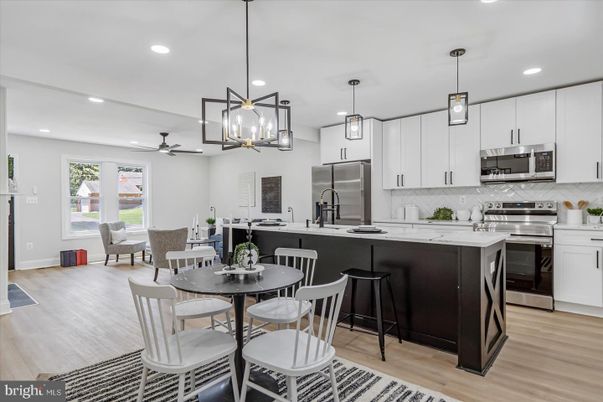 Dining room, Interior, Kitchen, Pendant Lights, Recessed Lighting, Stainless Steel Appliances, Wood Texture Flooring