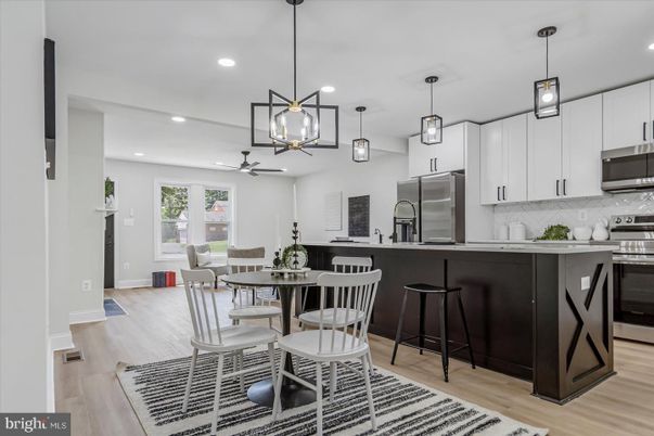 Dining room, Interior, Kitchen, Pendant Lights, Recessed Lighting, Stainless Steel Appliances, Wood Texture Flooring