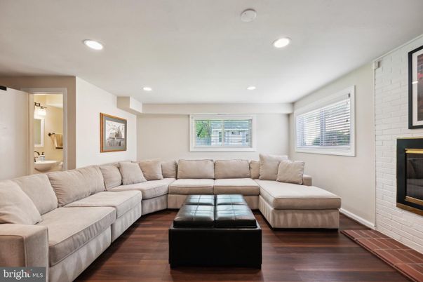 Fireplace, Interior, Living room, Recessed Lighting, Stone Walls, Wood Texture Flooring