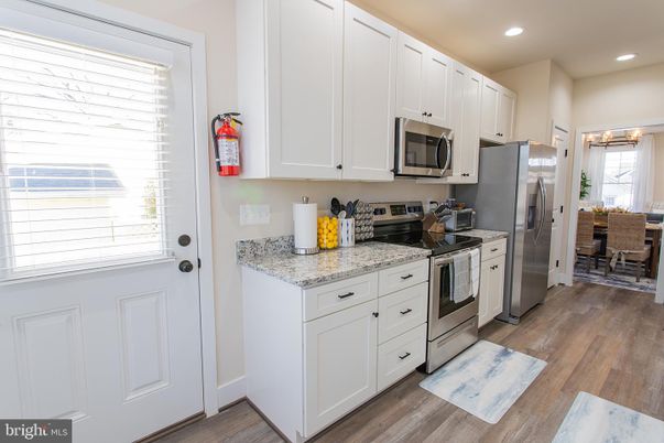 Dining room, Interior, Kitchen, Recessed Lighting, Stainless Steel Appliances, Wood Texture Flooring