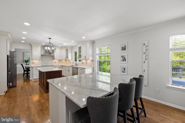 Chandelier, Dining room, Interior, Kitchen, Recessed Lighting, Stainless Steel Appliances, Wood Texture Flooring