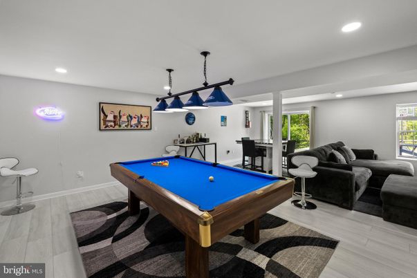 Billiard Table, Game Room, Interior, Living room, Pendant Lights, Recessed Lighting, Wood Texture Flooring