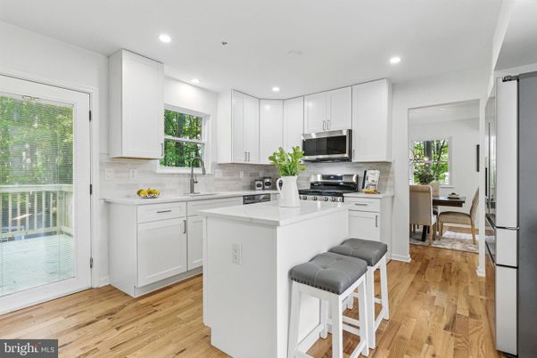 Dining room, Interior, Kitchen, Recessed Lighting, Stainless Steel Appliances, Wood Texture Flooring