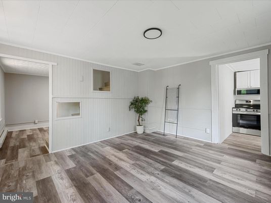 Empty room, Interior, Kitchen, Stainless Steel Appliances, Wood Texture Flooring