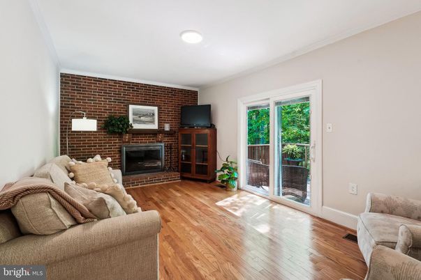 Fireplace, Interior, Living room, Recessed Lighting, Stone Walls, Wood Texture Flooring