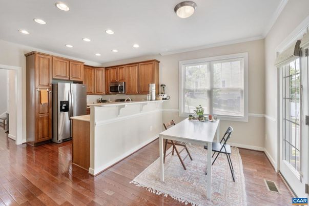 Dining room, Interior, Kitchen, Recessed Lighting, Stainless Steel Appliances, Wood Texture Flooring
