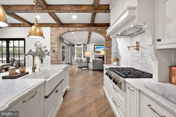 Fireplace, Interior, Kitchen, Living room, Pendant Lights, Recessed Lighting, Stainless Steel Appliances, Stone Walls, Wooden Beams, Wood Texture Flooring