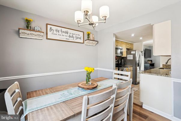Chandelier, Dining room, Interior, Kitchen, Recessed Lighting, Stainless Steel Appliances, Wood Texture Flooring