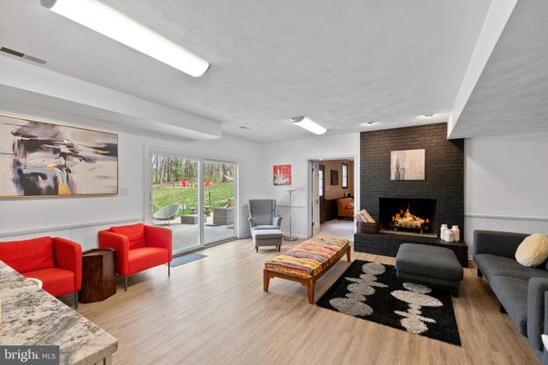 Fireplace, Interior, Living room, Recessed Lighting, Stone Walls, Wood Texture Flooring