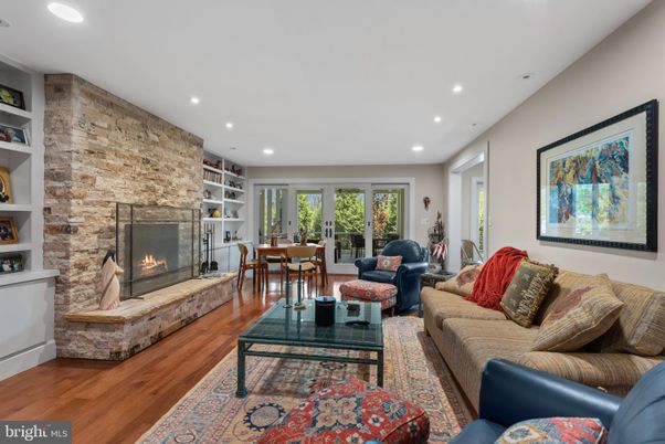 Dining room, Fireplace, Interior, Living room, Recessed Lighting, Stone Walls, Wood Texture Flooring