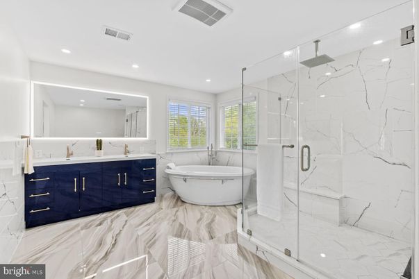 Bathroom, Dual Sink Vanities, Glass Shower, Interior, Marble, Marble Walls, Recessed Lighting