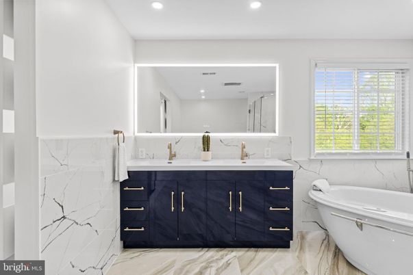 Bathroom, Dual Sink Vanities, Free Standing Baths, Interior, Marble, Marble Walls, Recessed Lighting