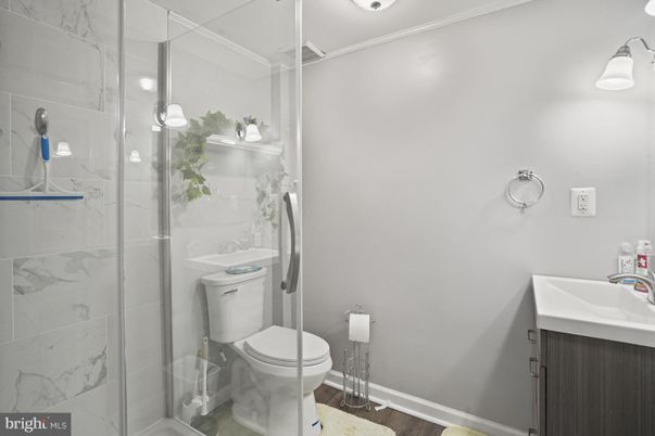 Bathroom, Glass Shower, Interior, Marble Walls, Wood Texture Flooring