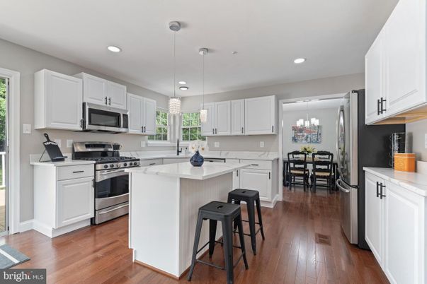 Chandelier, Dining room, Interior, Kitchen, Pendant Lights, Recessed Lighting, Stainless Steel Appliances, Wood Texture Flooring
