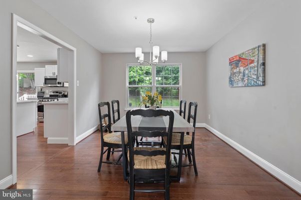 Chandelier, Dining room, Interior, Kitchen, Pendant Lights, Recessed Lighting, Stainless Steel Appliances, Wood Texture Flooring