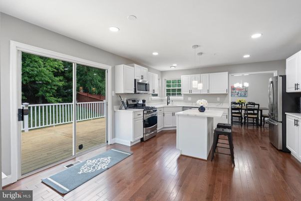 Dining room, Interior, Kitchen, Pendant Lights, Recessed Lighting, Stainless Steel Appliances, Wood Texture Flooring