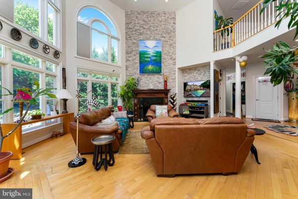 Fireplace, Interior, Living room, Recessed Lighting, Stone Walls, Wood Texture Flooring