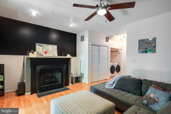 Fireplace, Interior, Recessed Lighting, Washer, Wood Texture Flooring