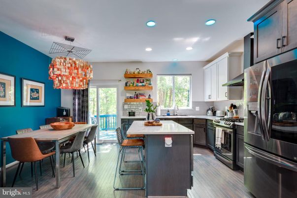 Chandelier, Dining room, Interior, Kitchen, Pendant Lights, Recessed Lighting, Stainless Steel Appliances, Wood Texture Flooring