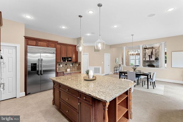 Chandelier, Dining room, Fireplace, Interior, Kitchen, Pendant Lights, Recessed Lighting, Stainless Steel Appliances