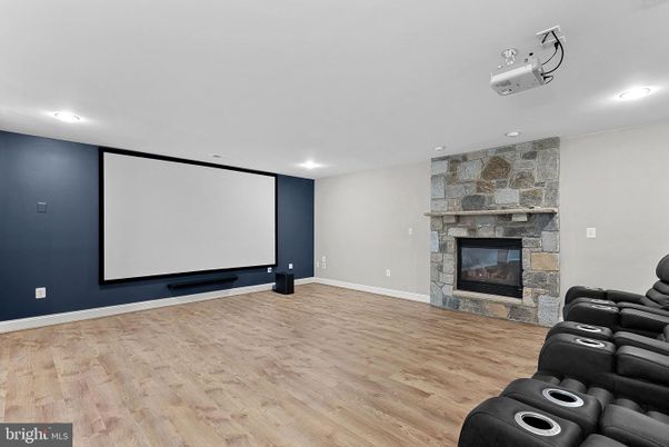 Home Theatre Room, Fireplace, Interior, Projection Screen, Recessed Lighting, Stone Walls, Theatre Room, Wood Texture Flooring