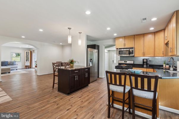 Dining room, Interior, Kitchen, Living room, Pendant Lights, Recessed Lighting, Stainless Steel Appliances, Wood Texture Flooring