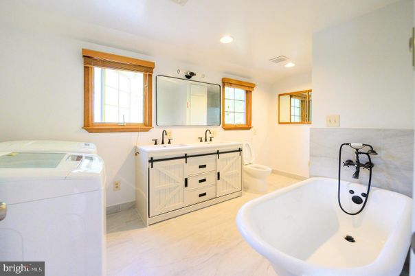 Bathroom, Dual Sink Vanities, Free Standing Baths, Interior, Marble, Recessed Lighting, Washer