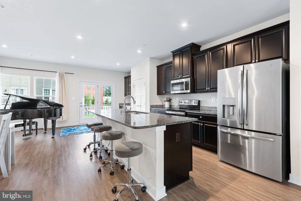 Interior, Kitchen, Piano, Recessed Lighting, Stainless Steel Appliances, Wood Texture Flooring