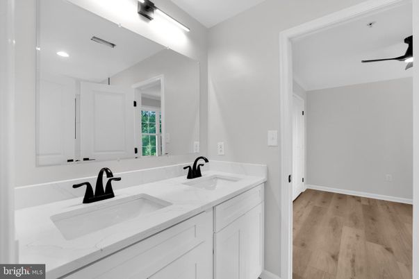 Bathroom, Dual Sink Vanities, Interior, Recessed Lighting, Wood Texture Flooring