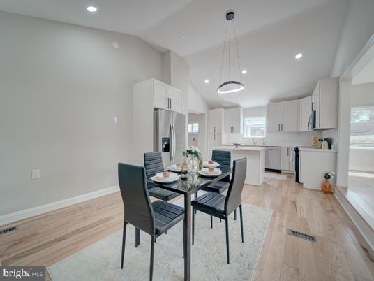 Dining room, Interior, Kitchen, Pendant Lights, Recessed Lighting, Stainless Steel Appliances, Wood Texture Flooring