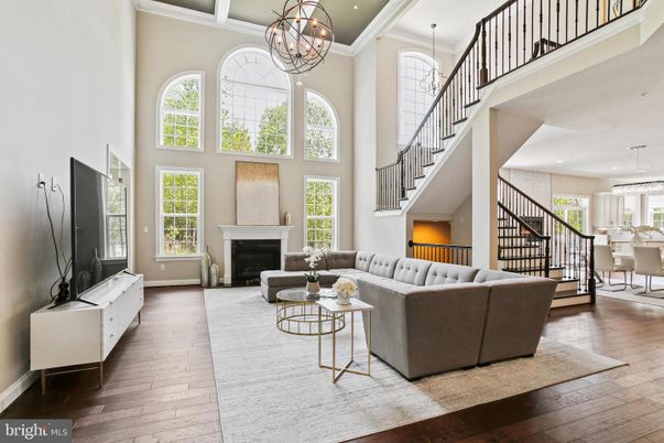 Chandelier, Fireplace, Interior, Living room, Pendant Lights, Recessed Lighting, Wood Texture Flooring
