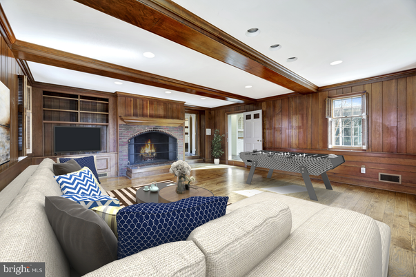 Fireplace, Game Room, Interior, Living room, Recessed Lighting, Wood Texture Flooring, Wooden Walls