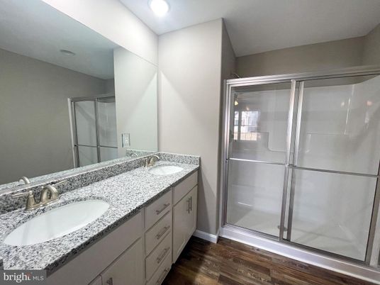 Bathroom, Dual Sink Vanities, Glass Shower, Interior, Recessed Lighting, Wood Texture Flooring