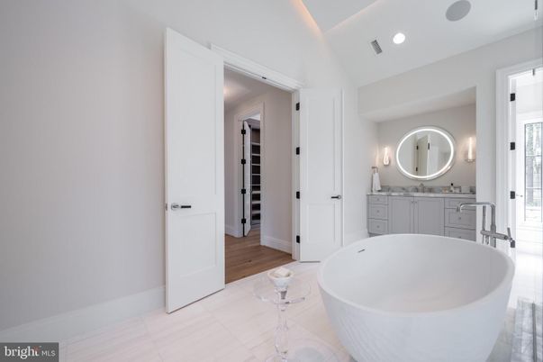 Bathroom, Dual Sink Vanities, Free Standing Baths, Interior, Recessed Lighting, Wood Texture Flooring