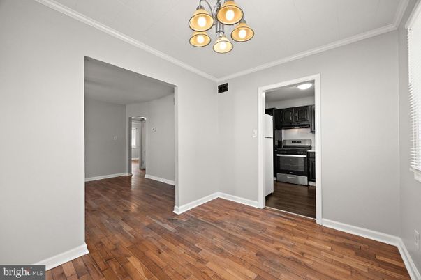 Empty room, Interior, Kitchen, Pendant Lights, Stainless Steel Appliances, Wood Texture Flooring