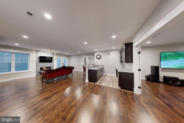 Fireplace, Interior, Kitchen, Living room, Recessed Lighting, Stone Walls, Wood Texture Flooring